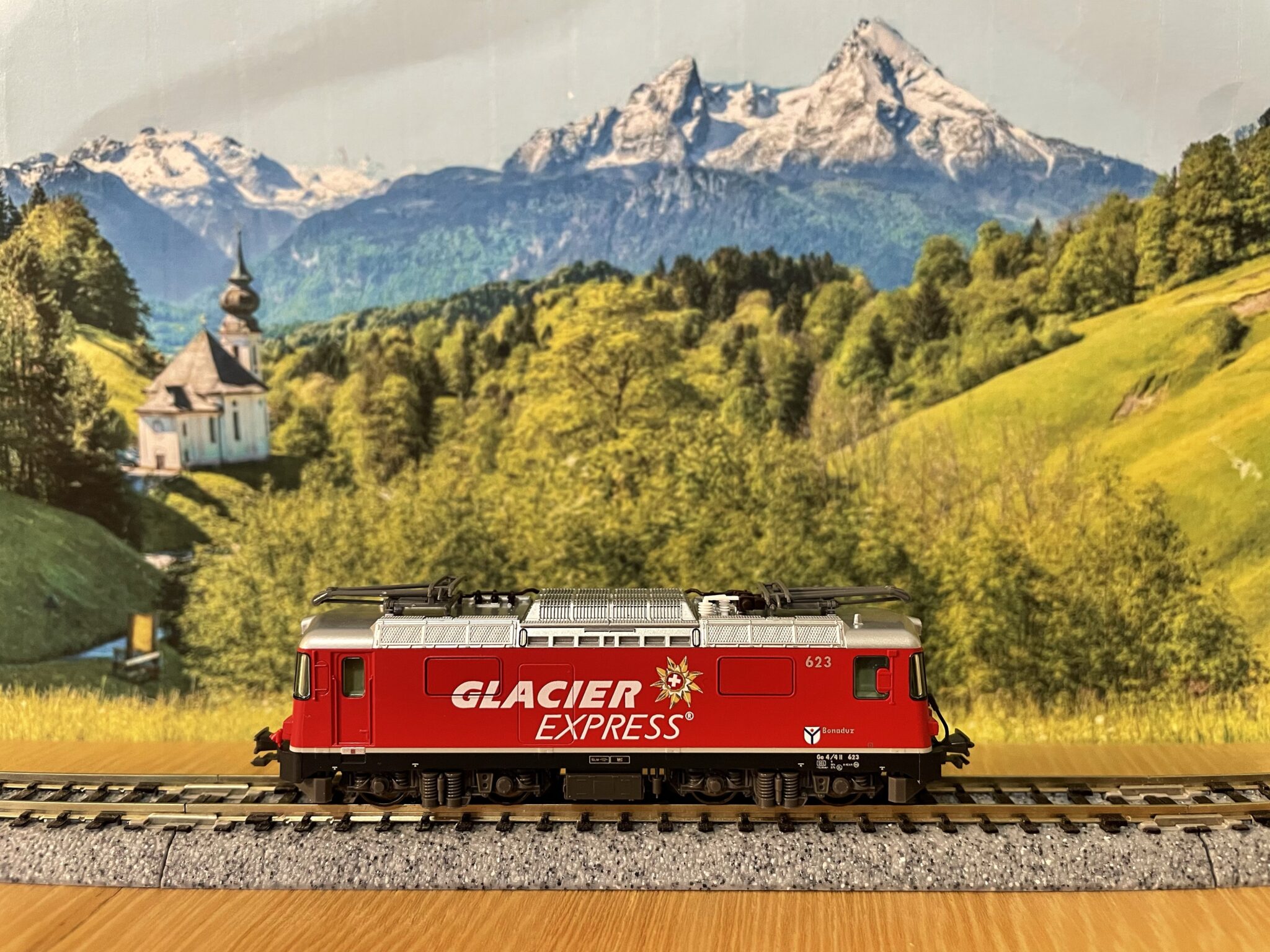 Purchases a Swiss model railway