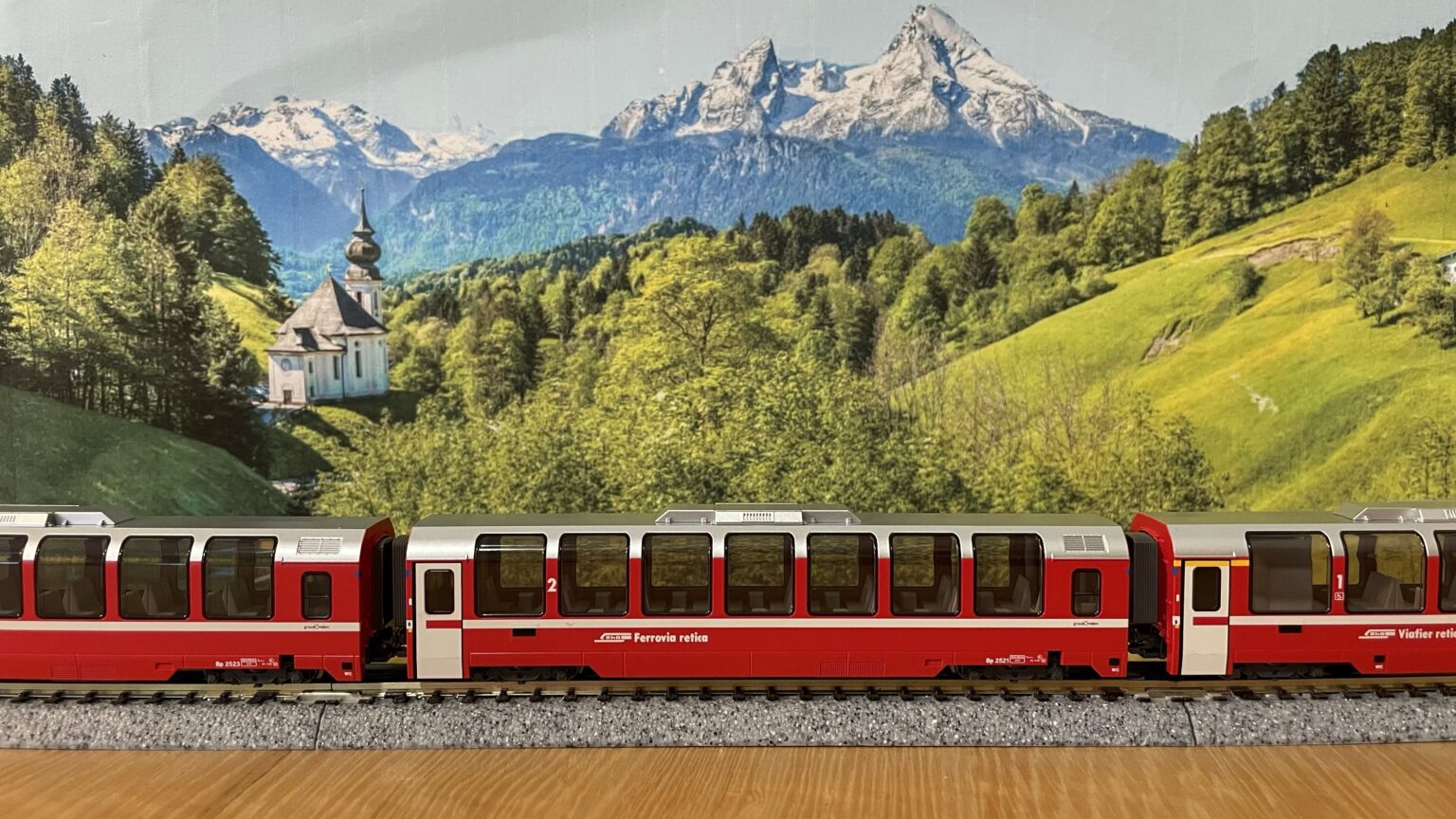 Purchases a Swiss model railway